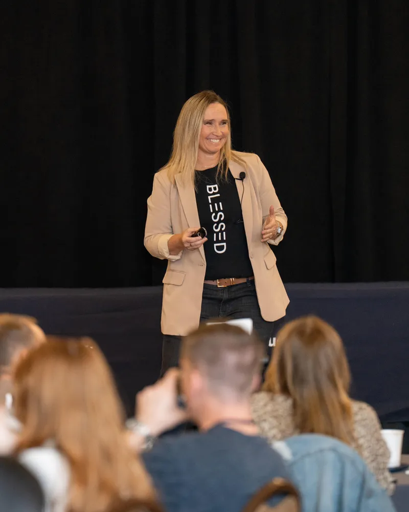 Natty Lewis speaking on stage